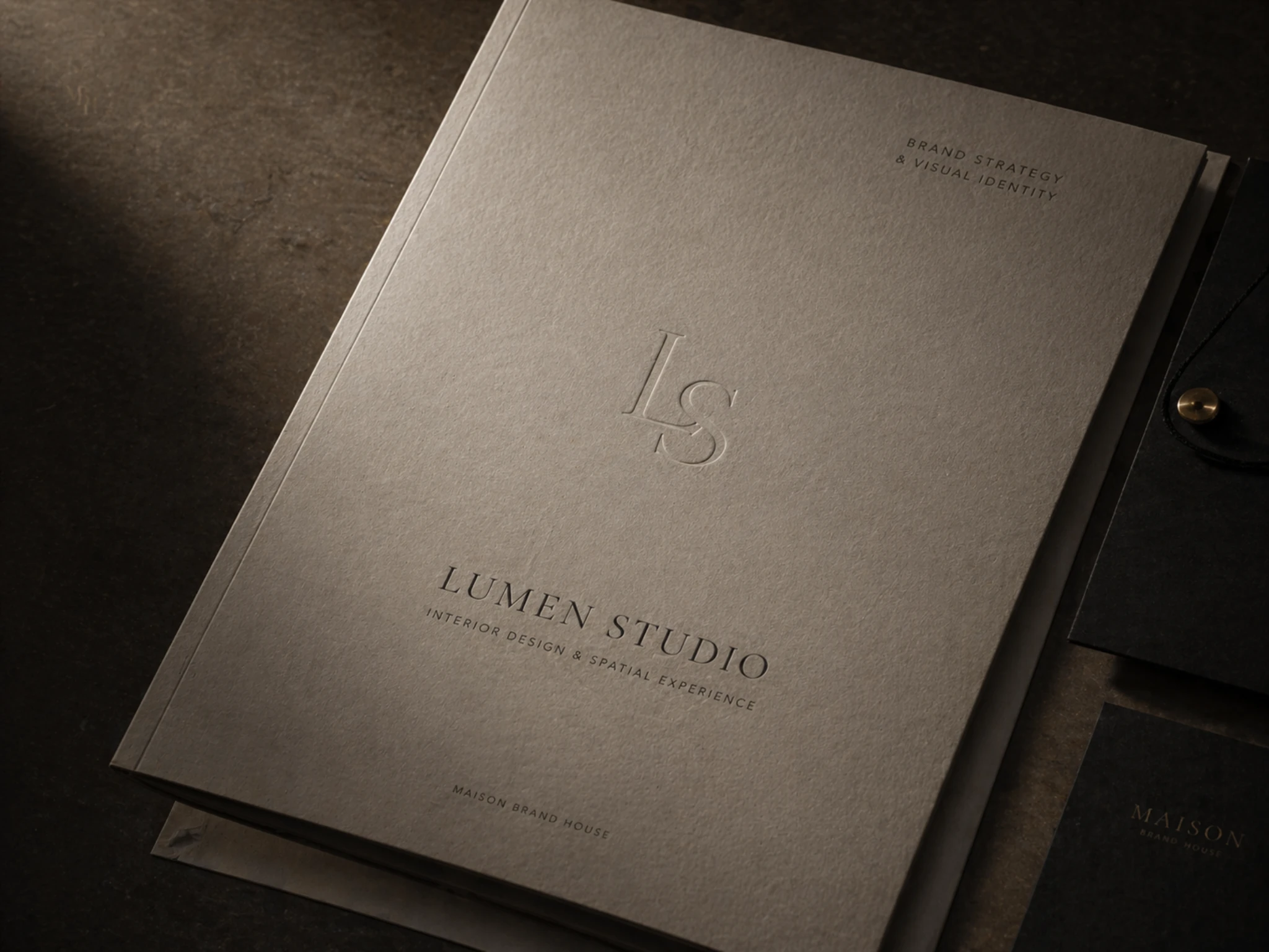 Lumen Studio embossed brand guide and notebook